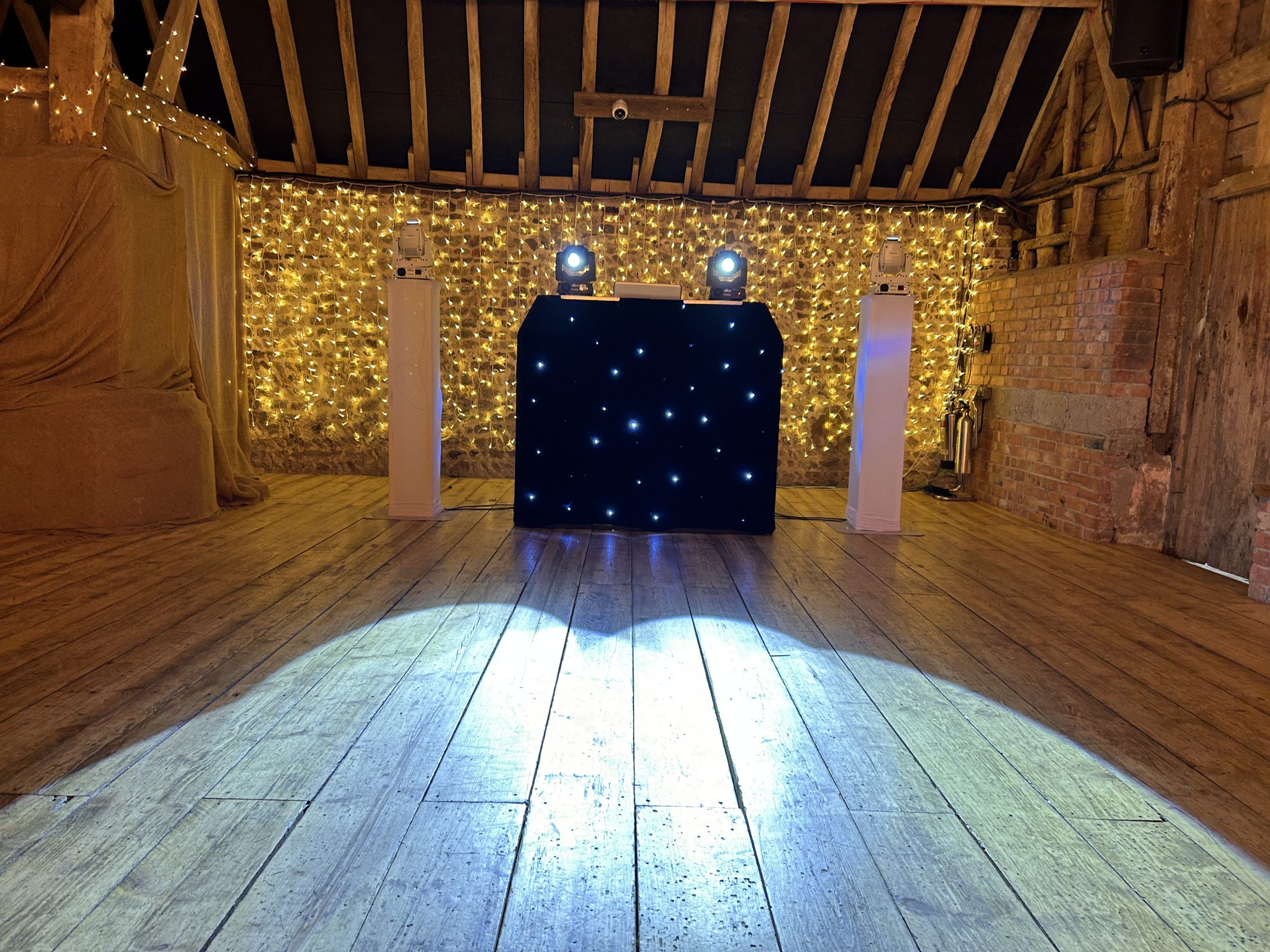 sdc-booth Sussex DJ Company DJ booth and lighting set up in a timber barn